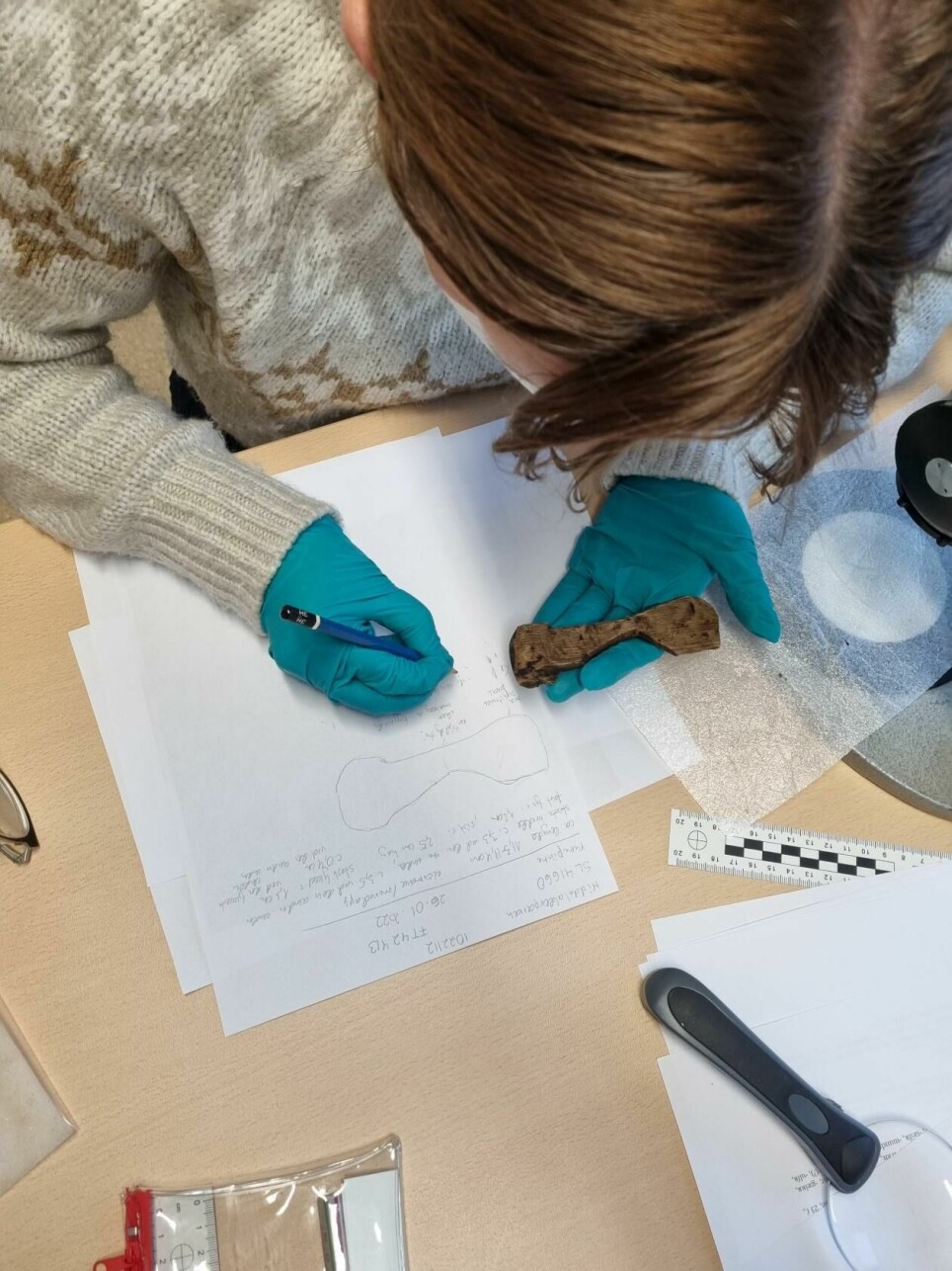 Kristel Zilmer at work with the third runic inscription from the ongoing excavation of the Medieval Park in Oslo. It’s important with direct access to the item in question in order not to overlook important marks that may impact the interpretation.