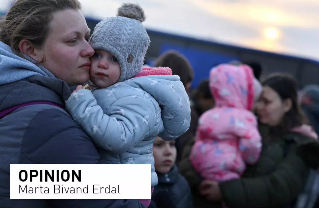 Media reports from the border crossings with Poland, suggest that Ukrainian border guards are overwhelmed by crowds, prioritizing Ukrainian women and children, leaving foreign nationals, notably from outside Europe, to wait. Pictured: Ukrainian women who were fleeing Russian invasion of Ukraine hold their children as they arrive at a temporary camp in Przemysl, Poland.