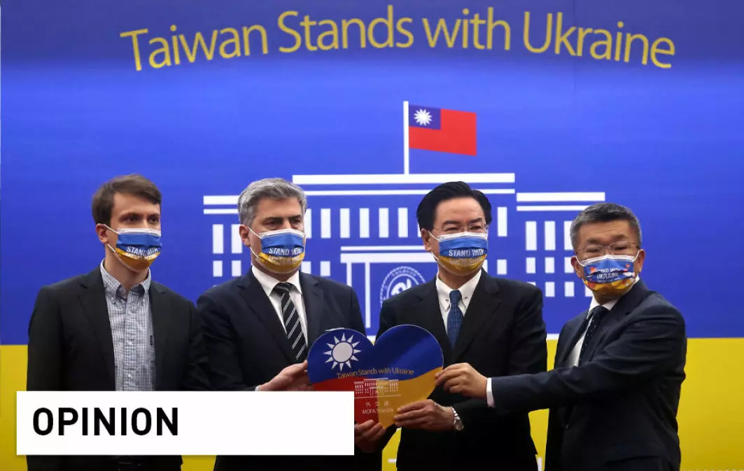 Taiwan's Foreign Minister Joseph Wu and Director of the Polish Office in Taipei, Cyryl Kozaczewski pose for a group photo after a news conference on humanitarian aid for Ukraine in Taipei, Taiwan, March 7.