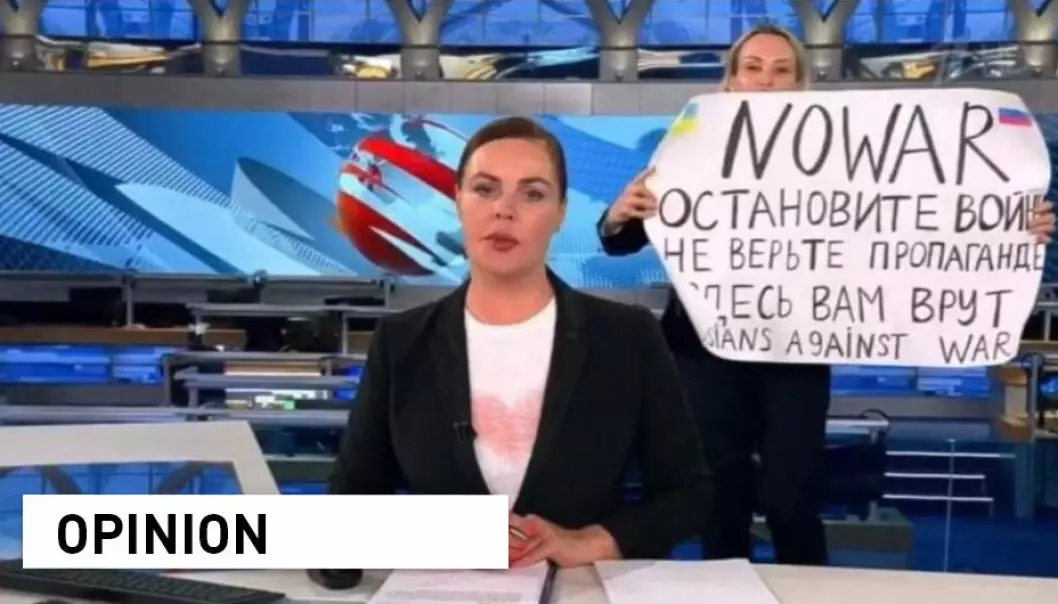 Russian Channel One editor Marina Ovsyannikova holds a poster reading 