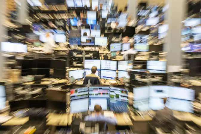 Broadband can help to democratize stock trading by more people being able to quickly gain access to the same information. This photo is from the brokerage room at DNB.