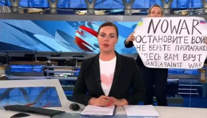 The by now famous incident from March 14, when Russian Channel One editor Marina Ovsyannikova held up a poster reading "Stop the war. Don't believe the propaganda. Here they are lying to you" during on-air TV studio by news anchor Yekaterina Andreyeva , Russia's most-watched evening news broadcast.