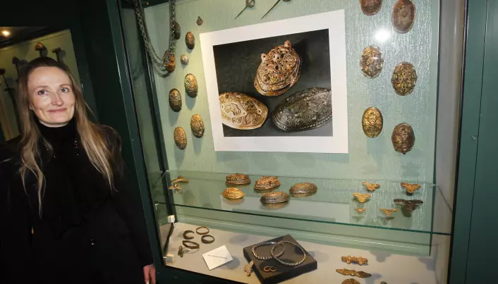 Archaeologist Unn Pedersen in front of a collection of Viking Age jewellery at the Museum of Cultural History in Oslo. Jewellery like this was produced en masse by skilled Viking Age smiths in the Viking towns in Scandinavia.