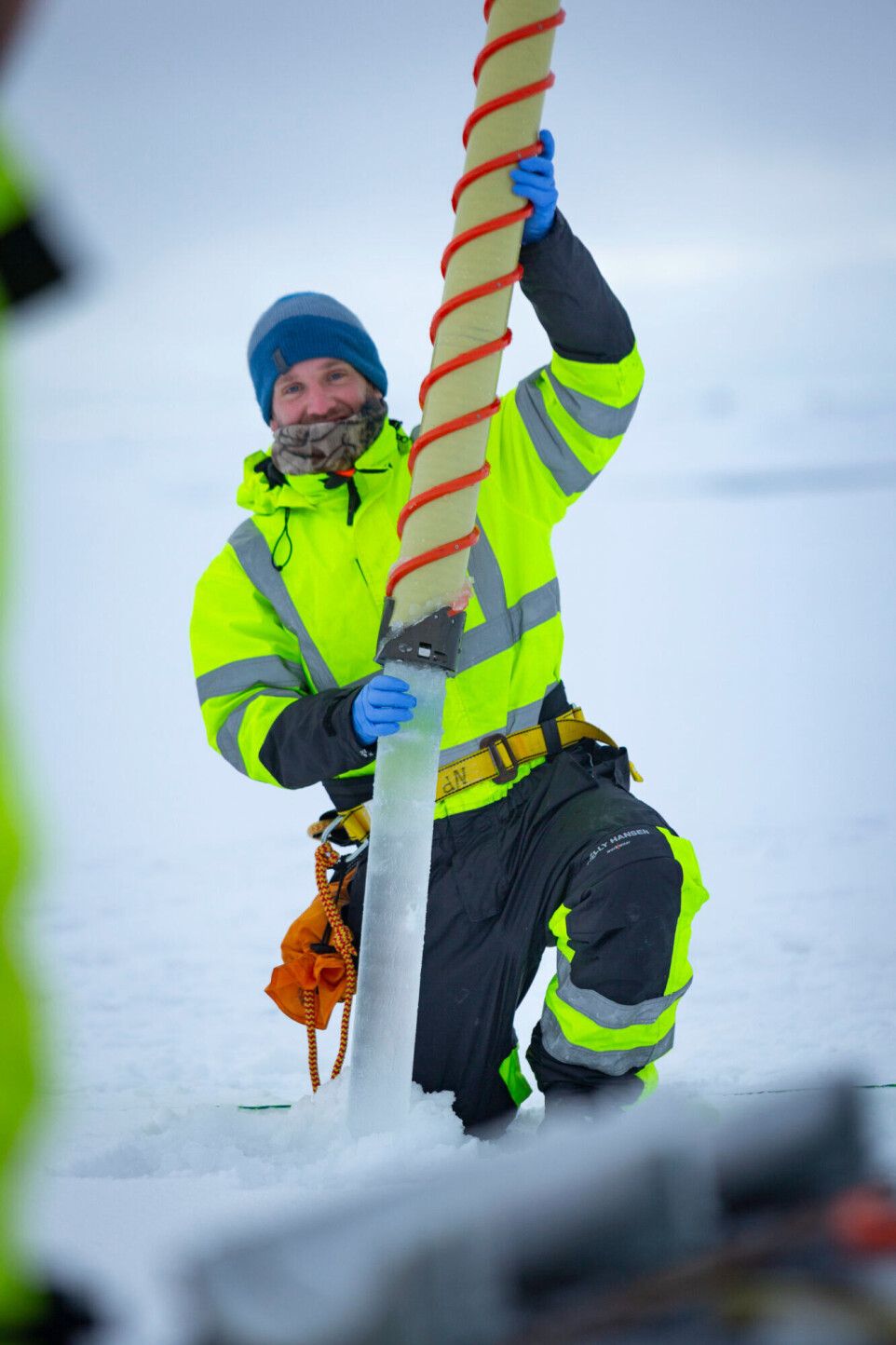 First author Stephen Kohler sampling through the ice cover on the Barents Sea.