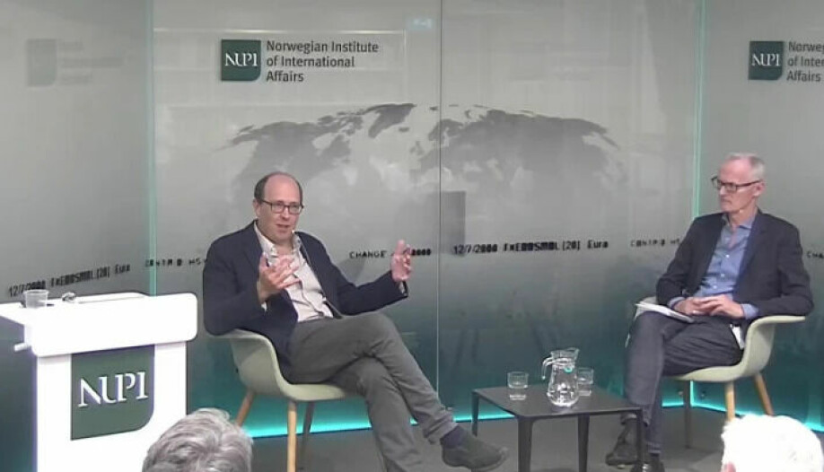 Henry Hale in conversation with Russian researcher Helge Blakkisrud during the NUPI event.