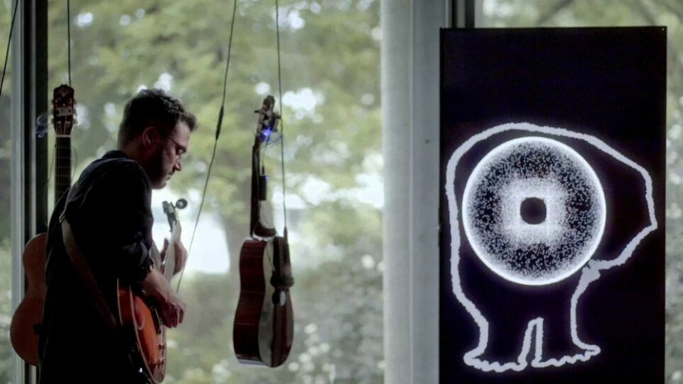 Cağrı Erdem performing with CAVI and the Self-Playing Guitars.