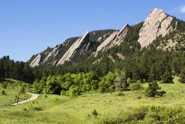 These distinctive flatiron mountains may resemble those found on the moon Io. But they are found in the United States, in Colorado.