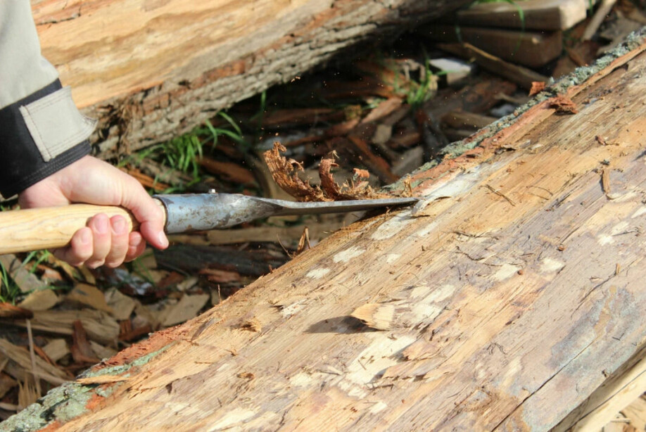 Before a log is split, the bark has to be removed.
