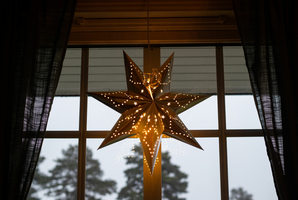 Stars hung in windows probably symbolize the Star of Bethlehem.
