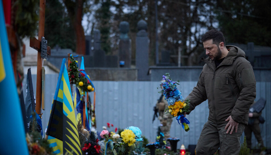 Ukrainian President Volodymyr Zelensky lays flowers on the grave of a Ukrainian soldier in Lviv on January 11 this year.