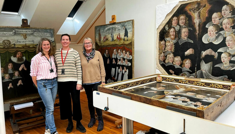 From left: painting conservators Lise Chantrier Aasen, Hilde Smedstad Moore and Anne Ytterdal with four of the five epitaph paintings that have been taken down from the walls of the Cathedral and brought to the studio at the Archaeological Museum.