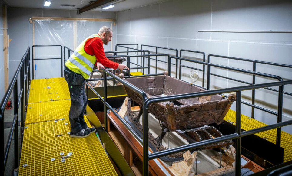 The Oseberg find contains some of the most fragile artifacts that will be placed in the new Viking Age Museum. Here, conservator David Hauer stands with two of the Viking sleighs.