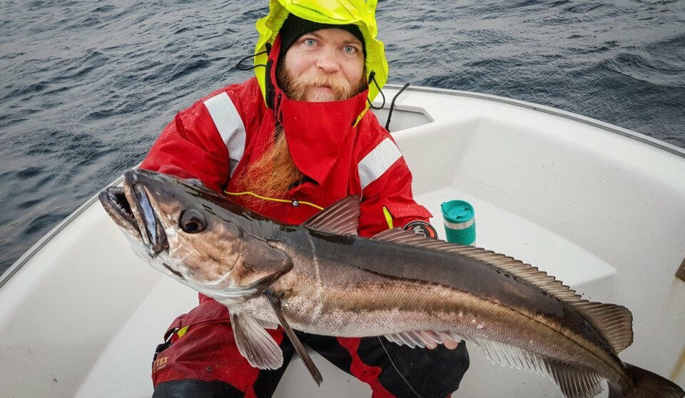 Jan Hinriksson, an IMR research technician and angling expert, shows off a hake weighing over 10 kg.