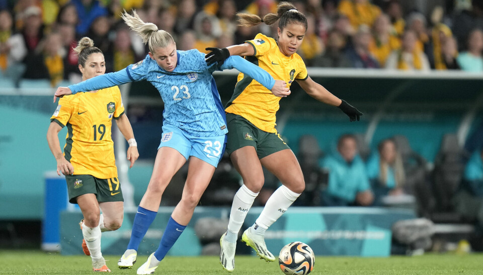 Australia's Mary Fowler and England's Alessia Russo during the Women's World Cup semifinal football match between Australia and England. England made it to the finals which will be played this Sunday against Spain.