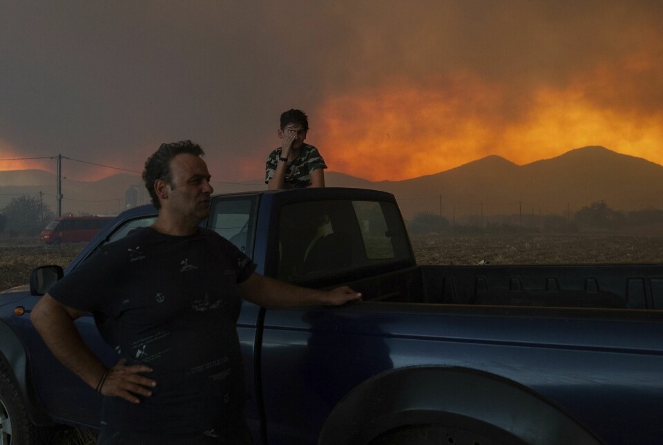 Local Greek residents look at the forest fire which raged near the city of Alexandroupoli. Greece is one of many countries that have been affected by heat waves this summer, and the forest fire is the largest ever observed in the EU.