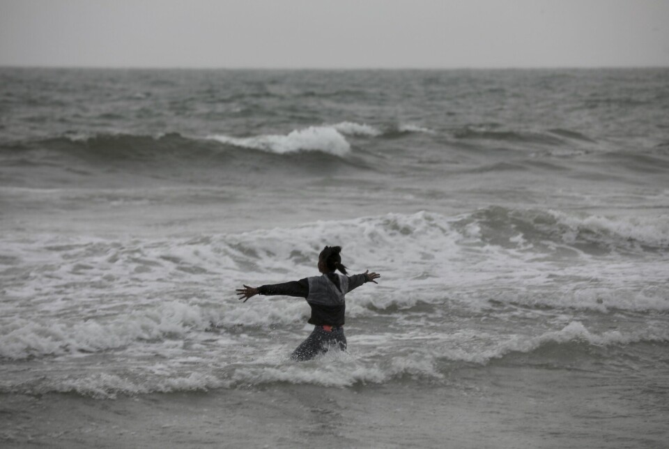A child plays in the waves ahead of Hurricane Idalia in South Carolina, USA. Exceptionally warm seas acted like 'rocket fuel' for the storm, according to a researcher at Colorado State University. High ocean temperatures can make hurricanes more powerful than they would be otherwise.