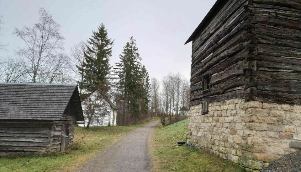 Some of the buildings in the farmyard at the Norwegian Emigrant Museum. Notice the gap between the timber logs.