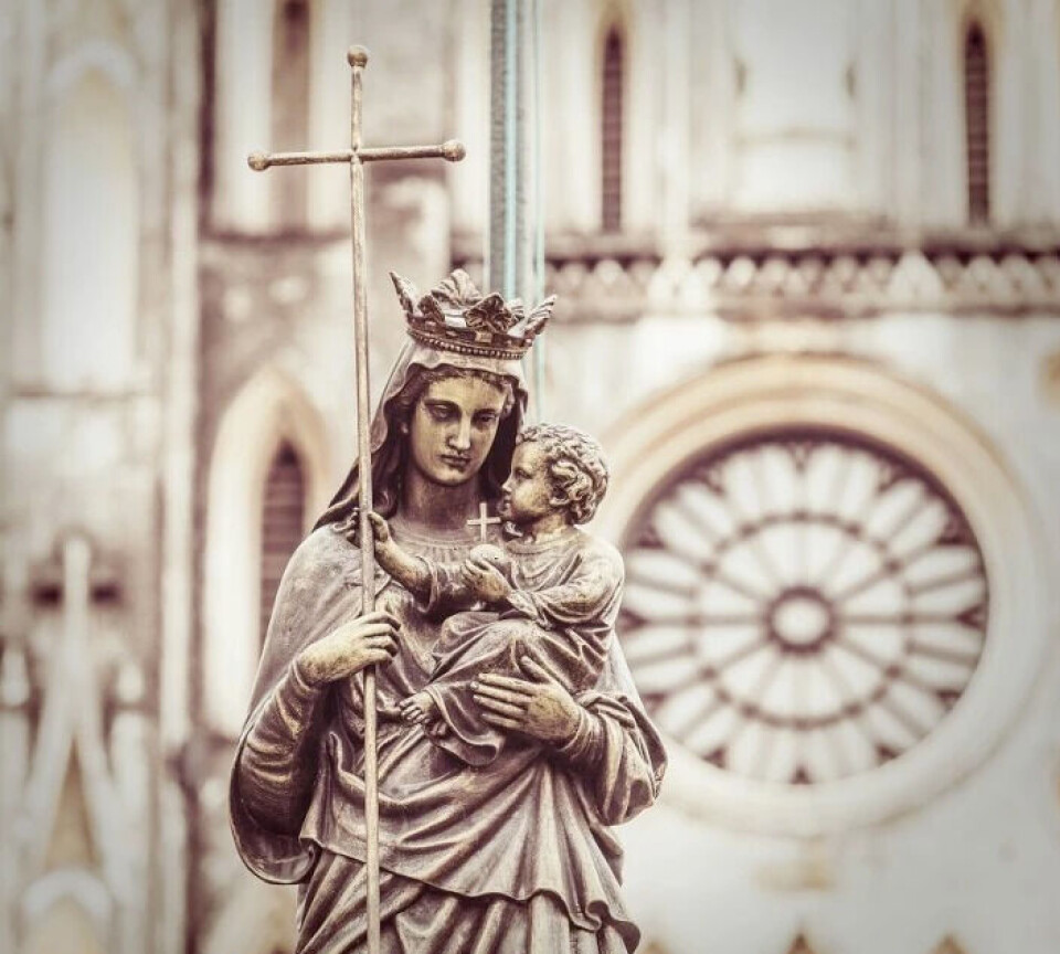 The Virgin Mary is usually depicted cradling baby Jesus in the crook of her left arm. The Virgin Mary is usually depicted cradling baby Jesus in the crook of her left arm.