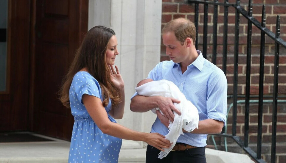 William cradles babies in the crook of his right arm. He is left-handed. William cradles babies in the crook of his right arm. He is left-handed.