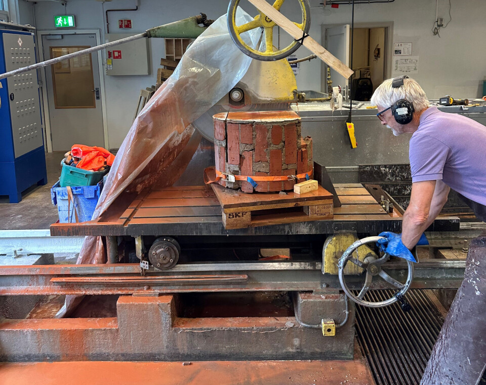 Senior Engineer Erik Johansen at SINTEF seen here using a saw to create rectangular test pieces.