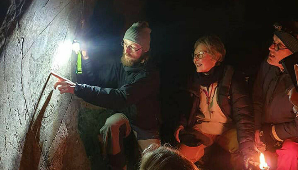 Even after the petroglyphs have been cleaned of algae and dirt, they can be difficult to see. When Kjell André Brevik shines the flashlight diagonally along the rock, the dotted figures come to life.