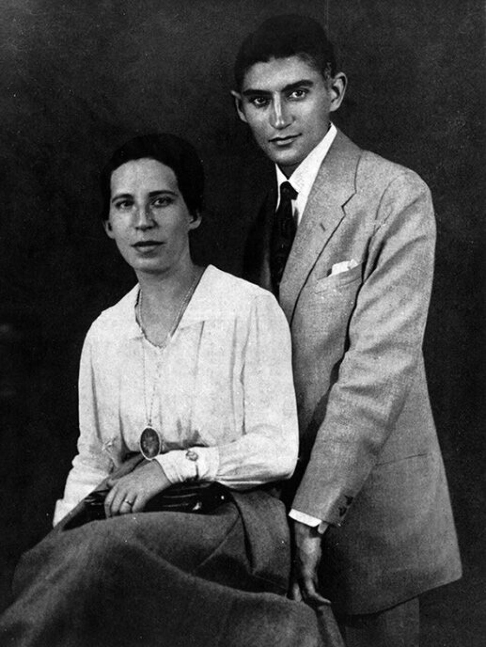 Franz Kafka describes how he turns and twists the photo of his fiancée Felice Bauer to try to meet her gaze. Here is a photograph of the two together.