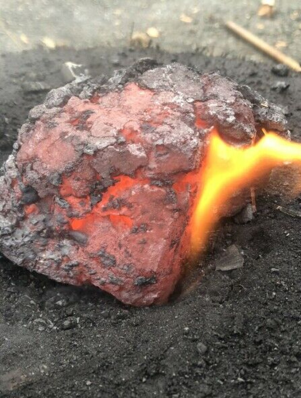 A glowing lump of iron straight from the furnace.