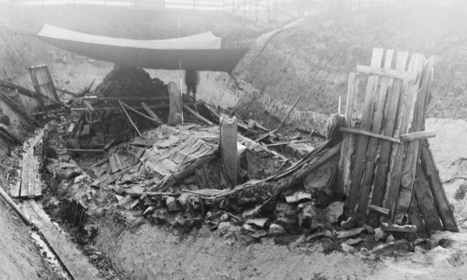 The Oseberg Ship under excavation. The burial chamber is clearly visible in the middle of the ship.