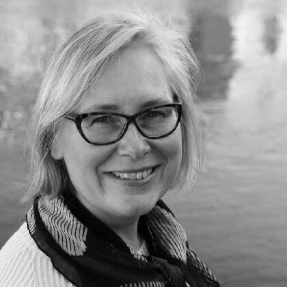 Anna Petersén is an archaeologist and researcher at the Norwegian Institute for Cultural Heritage Research (NIKU) Black and white photo of a woman with short blonde hair and black glasses.