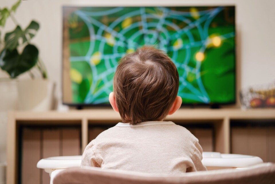 'Understanding how socioeconomic background affects children's early health is essential for creating effective interventions that can reduce disparities later in life,' says researcher Jennifer Harris. Toddler watching TV.