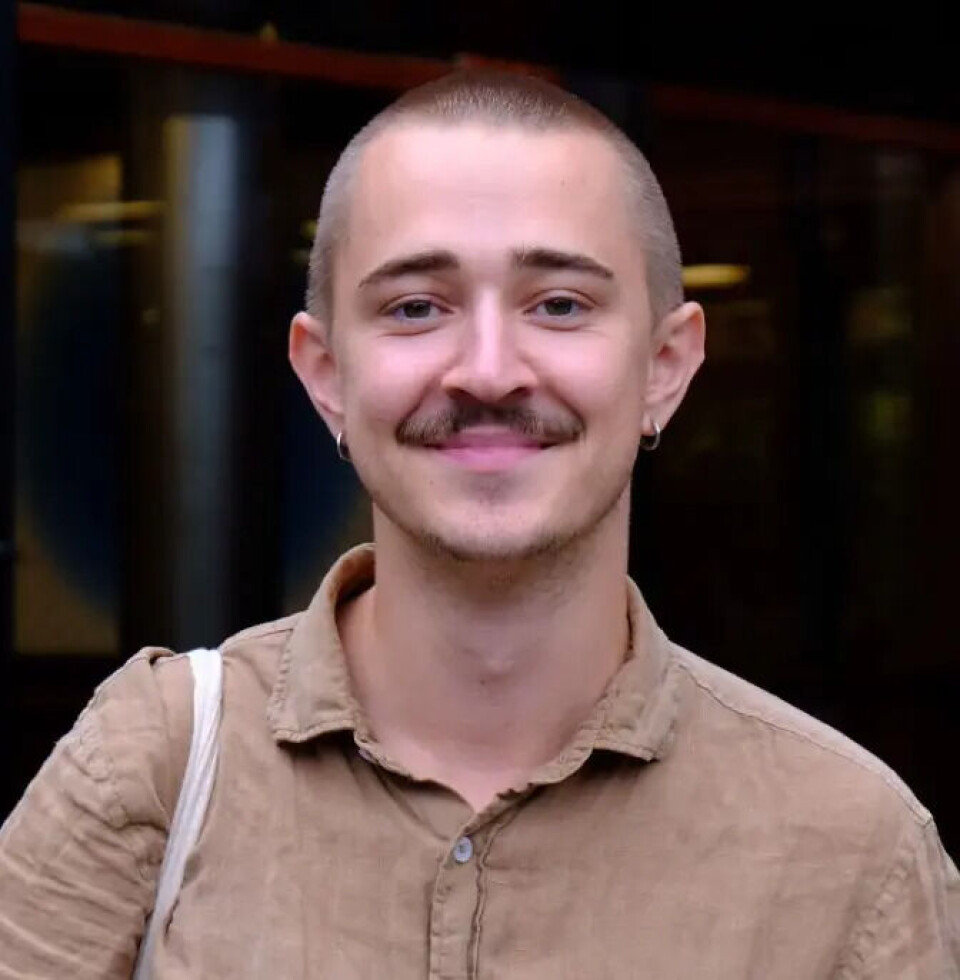 'An oil company? I never would have guessed,' saysEmil Kvebæk Øvretveit, who thought Greenpeace coined the term 'carbon footprint.' A man with a moustache and short hair smiles at the camera.