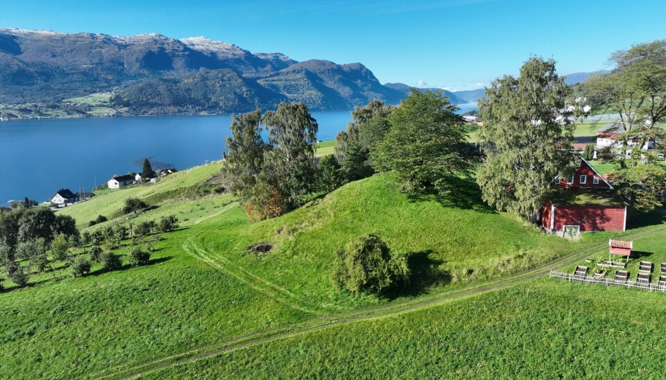 Aerial photo of Karnilshaugen with a view towards Gloppefjorden. It has now been confirmed that it is a man-made burial mound, likely from the Iron Age.