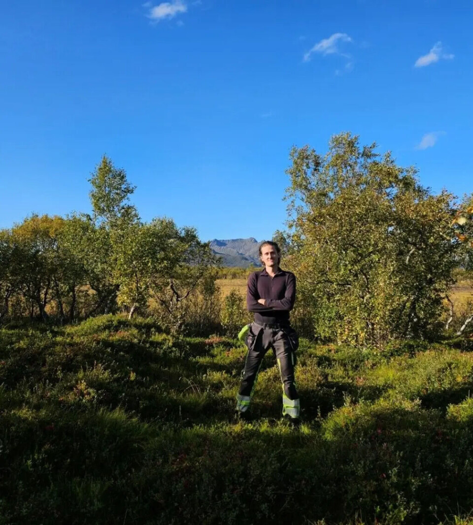 Ingar Moen Johnsen stands inside one of the house foundations in the farm complex.