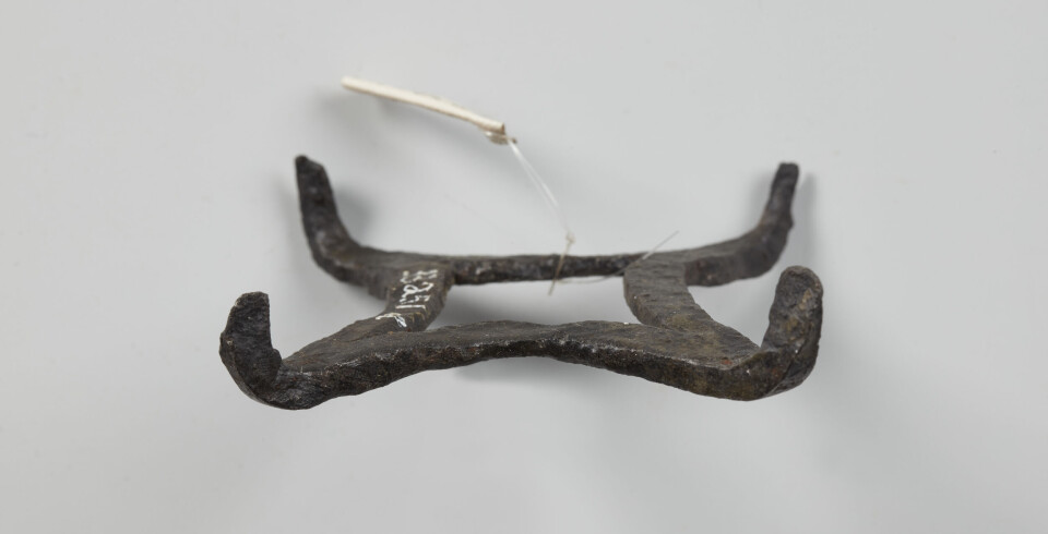 A square crampon with a spike at each corner from the Viking Age.