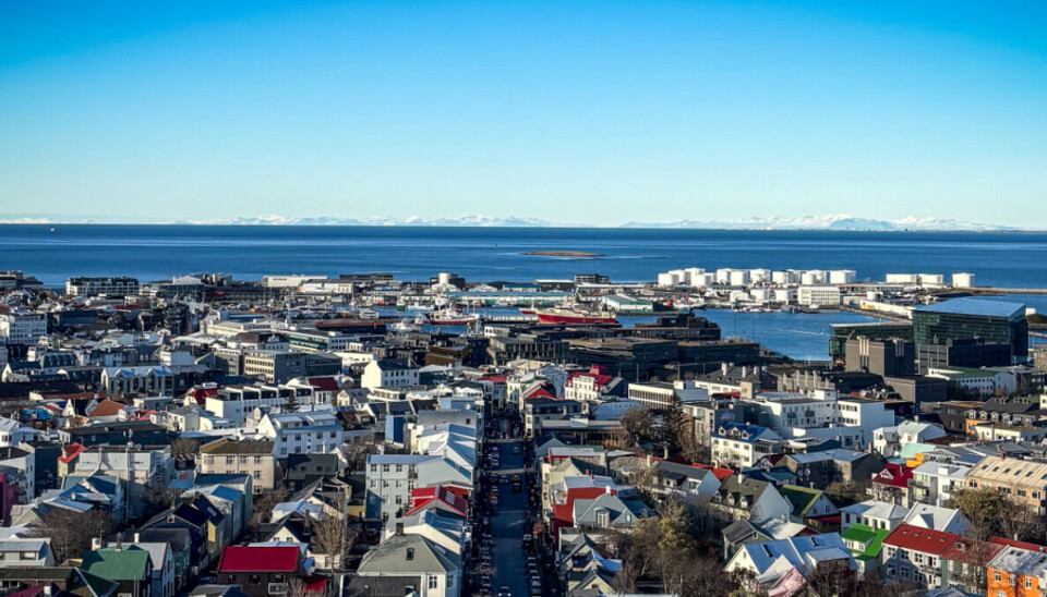 Reykjavík's dense urban core meets industrial harbour, demonstrating how northern cities must balance development with harsh maritime conditions.