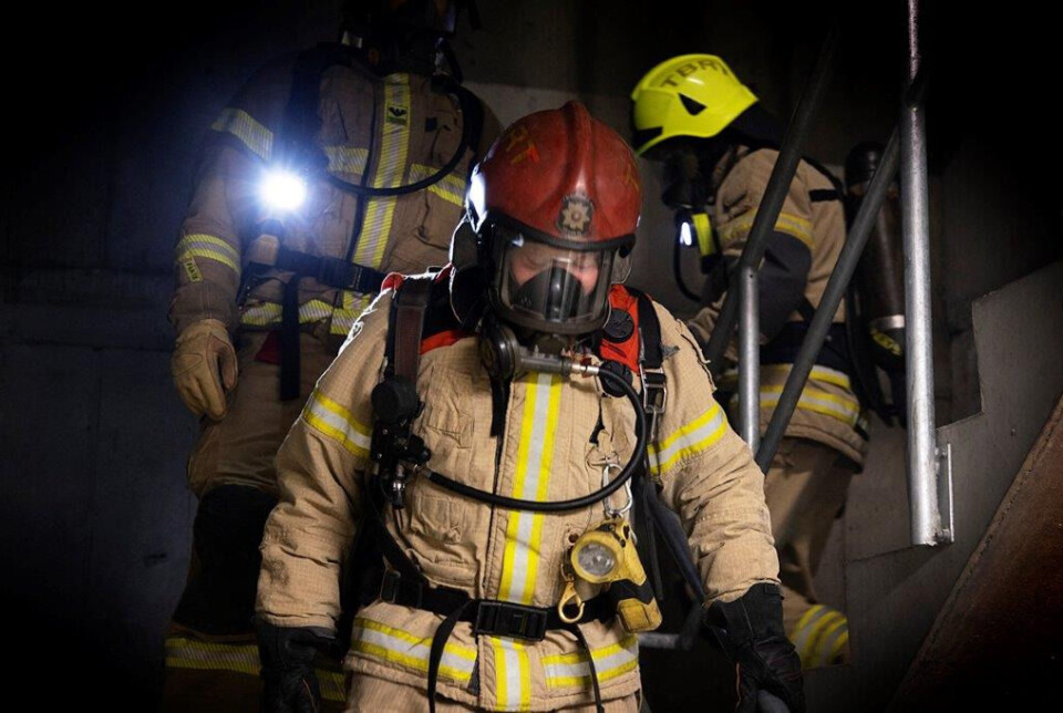 A simulated smoke dive revealed high physiological strain on the firefighters. Three firefighters walking down some stairs.