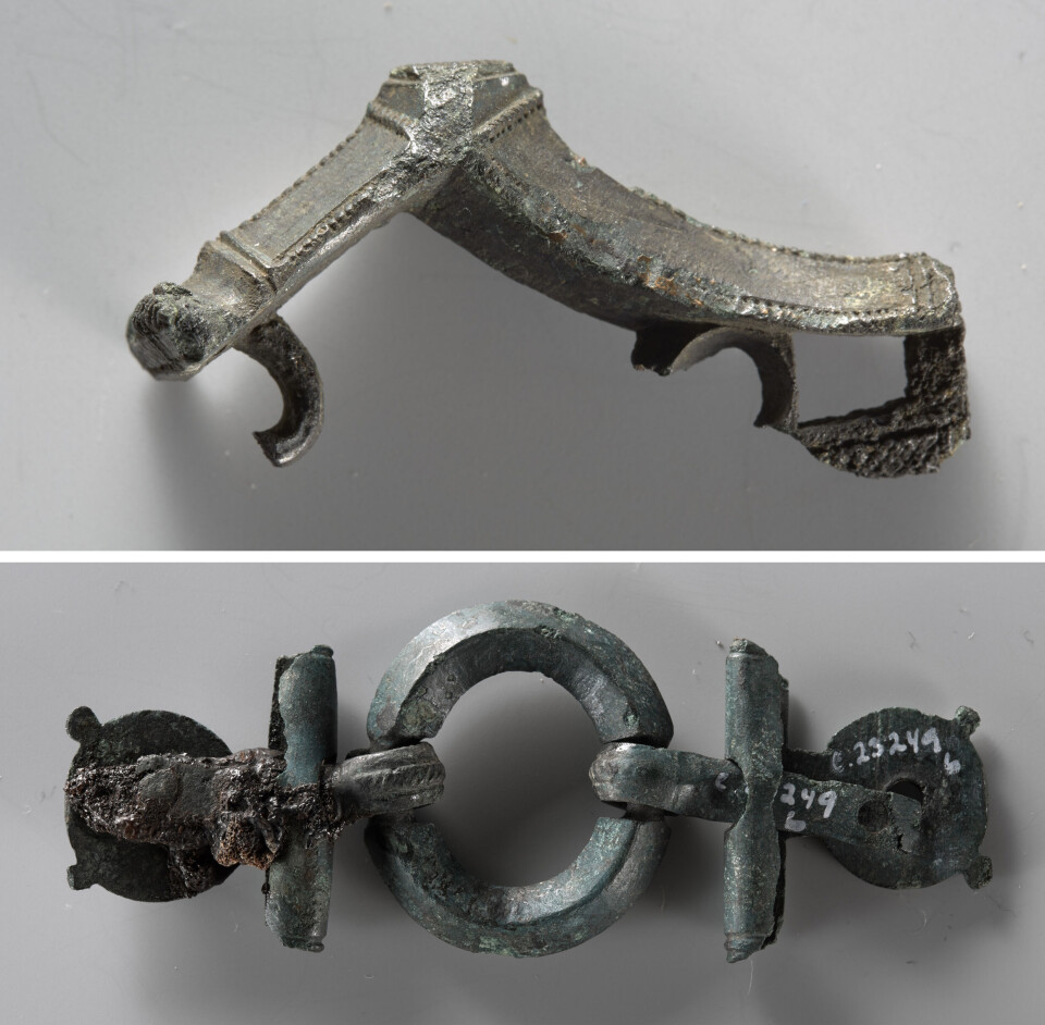 The fibula (brooch) at the top is a kind of 2,000-year-old safety pin. The bottom picture shows parts of a belt buckle. A sickle, an awl, a knife, and a vessel were also found in the grave.