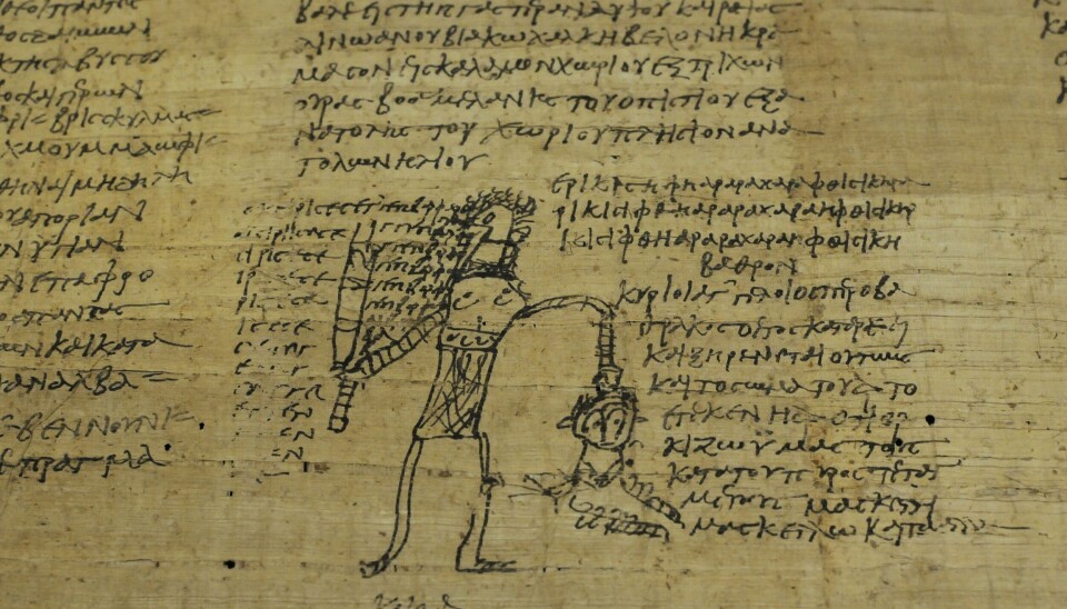 Spell formula with an illustration. Strektegning på en gammel papyrus.