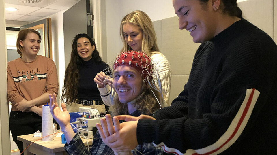 Research assistants Rebekka Skoglund, Emilie Alvarez Orvik, Gine Strøm Gutterup, Lina El-Agroudi, and Andreas Løve (in front with electrode cap) are training in EEG measurements for the project.