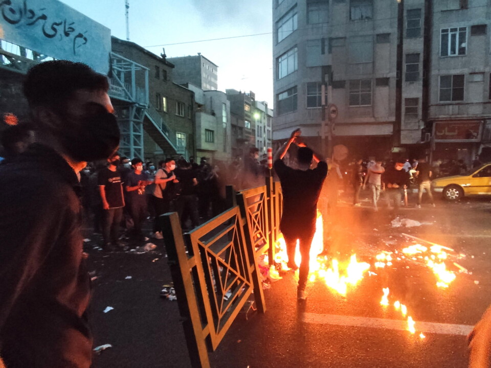 People clash with the police during a protest after the killing of Jina Masha Amini in September 2022.