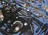 Array of ancient metal weapons, tools, and ornaments spread out on a blue background