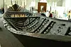Preserved Nydam oak warship hull on display inside a museum gallery