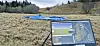 Laptop screen monitors a drone flight over a grassy field near Trondheim