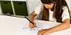 Girl practicing writing letters