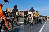 Group of cyclists commuting along a marked cycle road on a bridge in Copenhagen