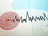 Seismografkurve og røde konsentriske sirkler som markerer jordskjelv på kart.