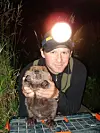 Man holding up a beaver