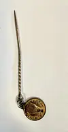 Metal pin with a round gold-colored medallion on a white background