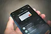 Smartphone displaying the Google Pay app with a payment card on screen.