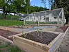 Raised vegetable beds surrounded by wire mesh.